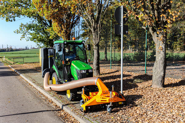 Matev MRM-120 suction sweeper connected to a compact tractor collection system